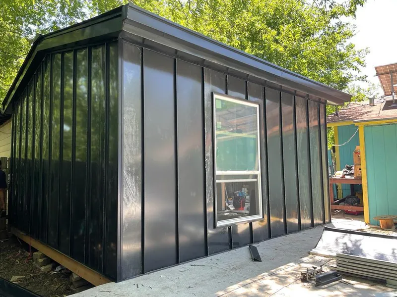 Black standing seam metal wall panels for Roof Inspection in Valencia West